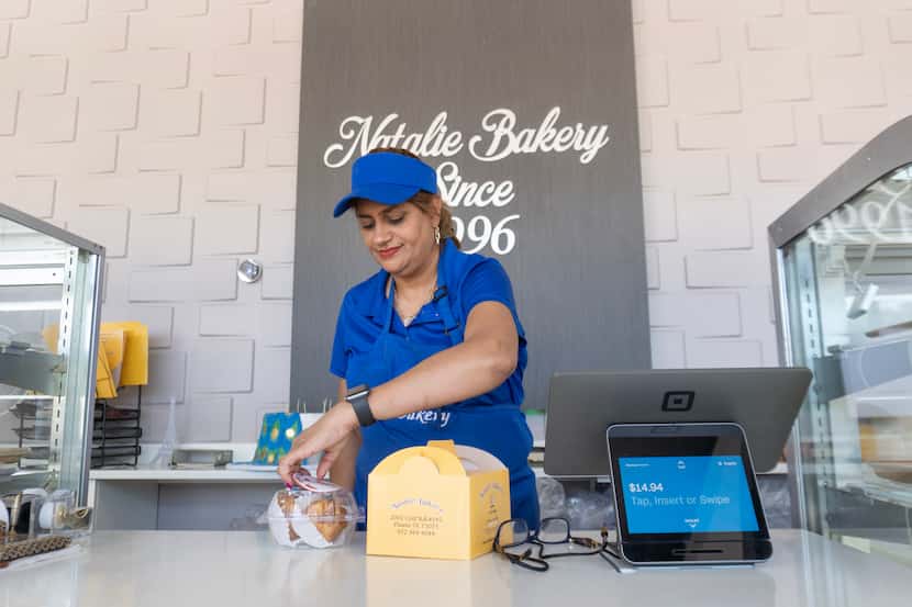 Mastaneh Shams packs sweets for a customer at Natalie Bakery on Saturday, June 8, 2024, in...