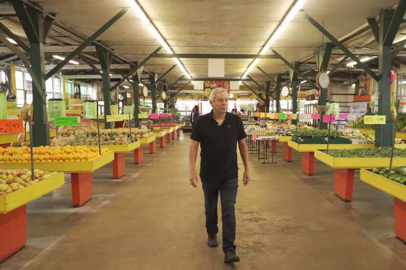 Food writer and chef Adán Medrano shops at Houston's Airline Farmers Market in the opening...