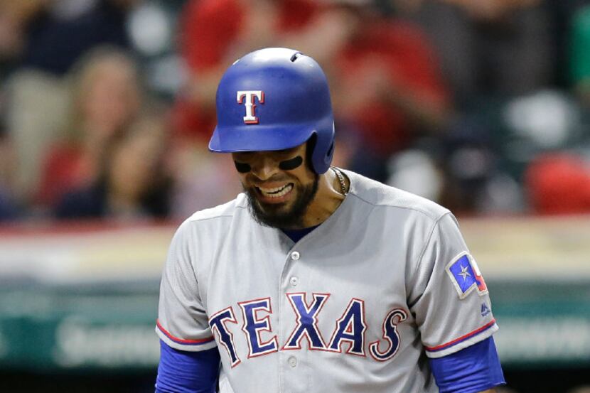 Texas Rangers' Robinson Chirinos reacts after striking out against Cleveland Indians relief...