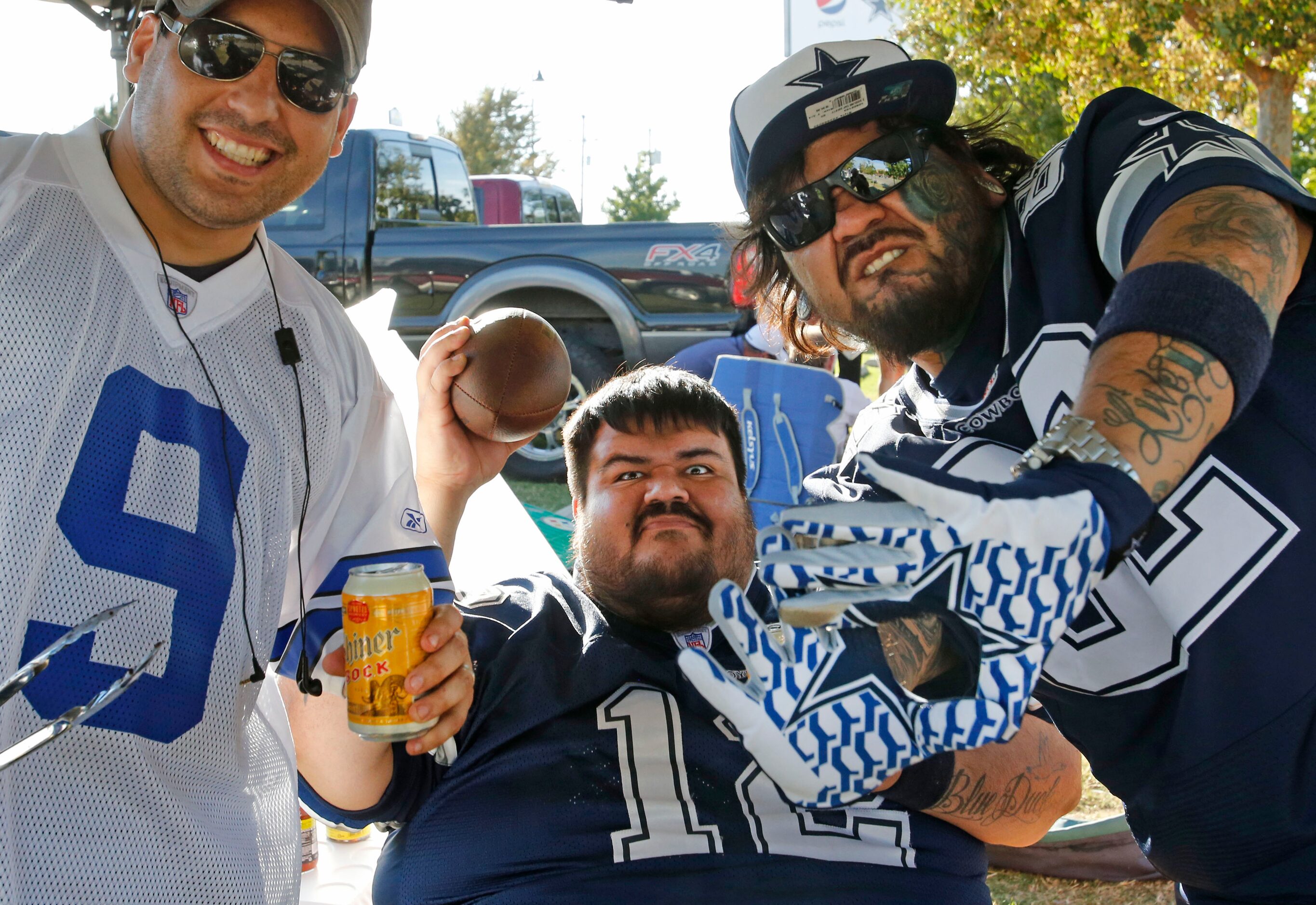 Jesse Rivera, Mark Benitez and Mickey Benitez get their game faces on as they tailgate...