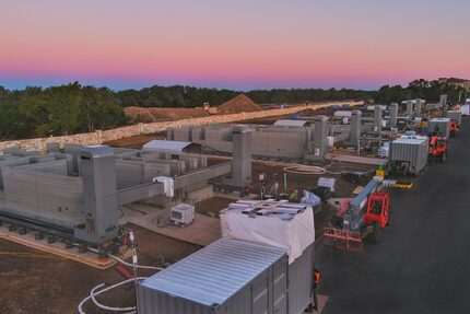 A fleet of 3D printers construct the walls of new homes in the Wolf Ranch residential...