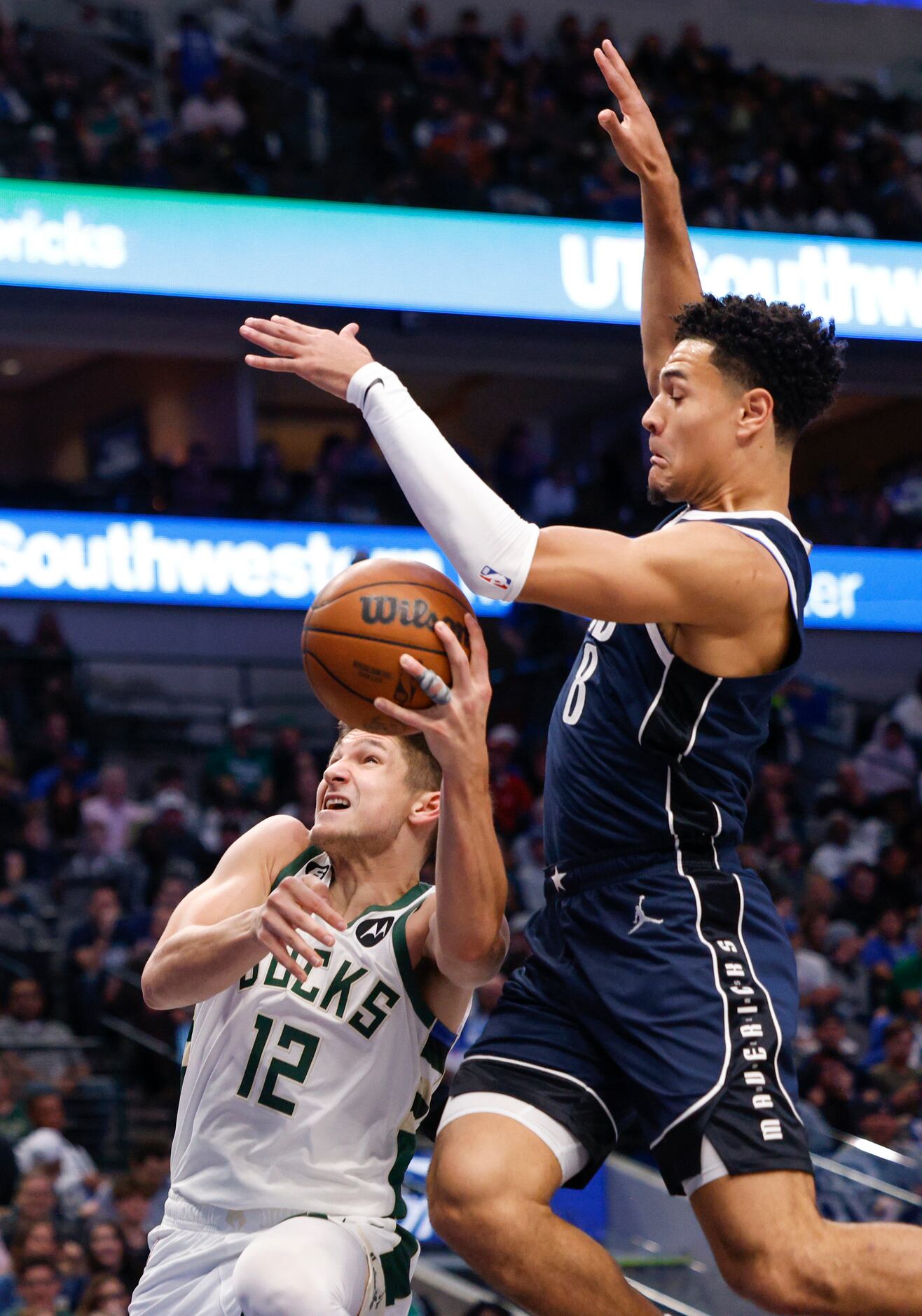 Dallas Mavericks guard Josh Green (8) collides with Milwaukee Bucks guard Grayson Allen (12)...