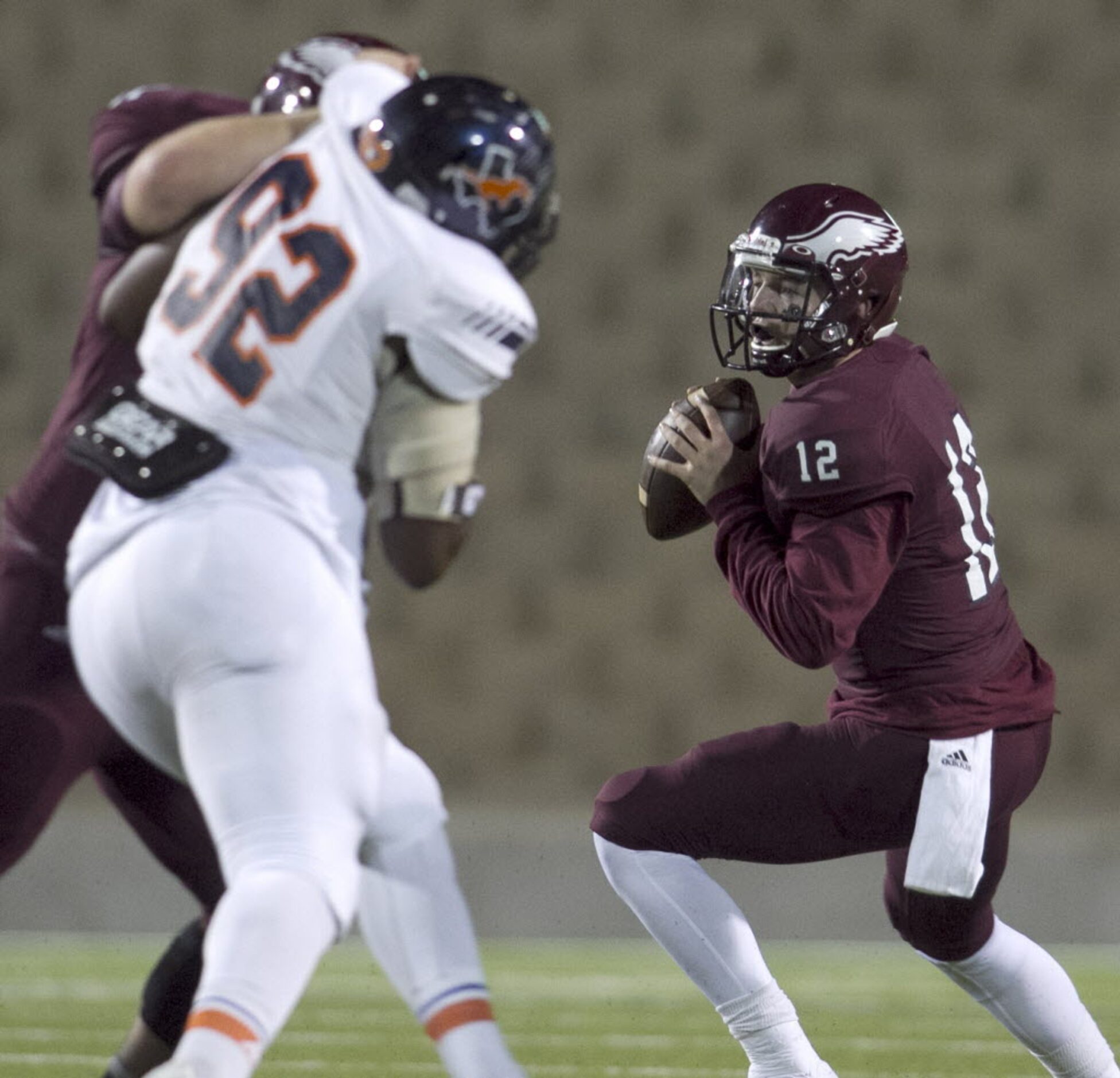 Rowlett quarterback Logan Bonner (12) prepares to pass downfield to an open receiver as his...