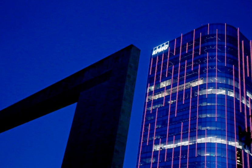 
LED strips on the exterior of the 18-story KPMG Plaza tower on Ross Avenue can flash...