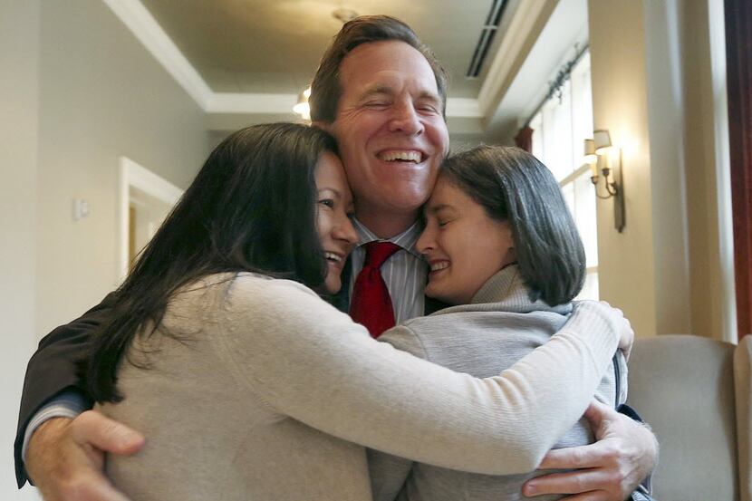 Cleopatra DeLeon (left) and Nicole Dimetman hug attorney Neel Lane after the decision by...
