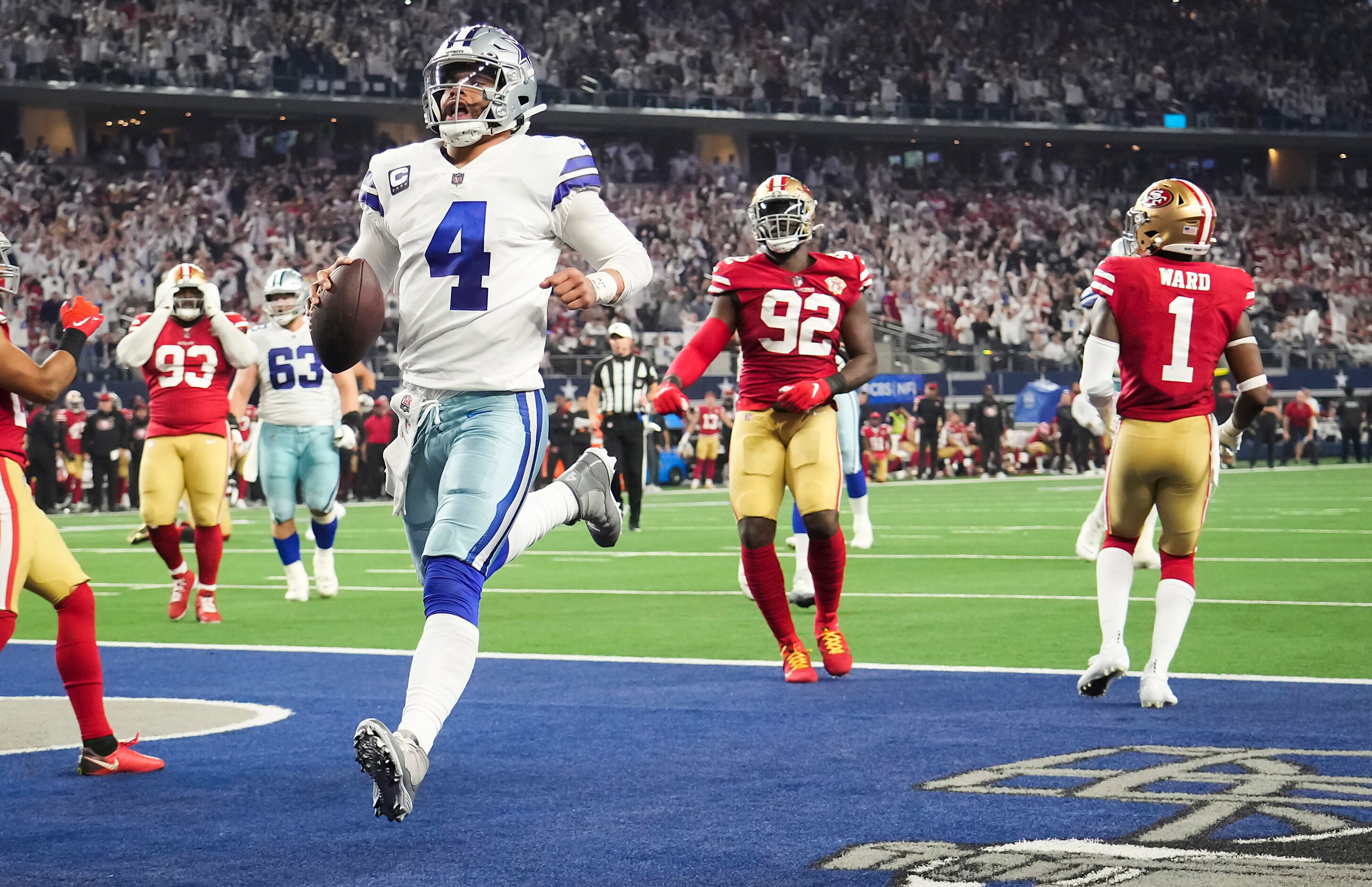 Dallas Cowboys quarterback Dak Prescott scores on a touchdown run during the second half of...