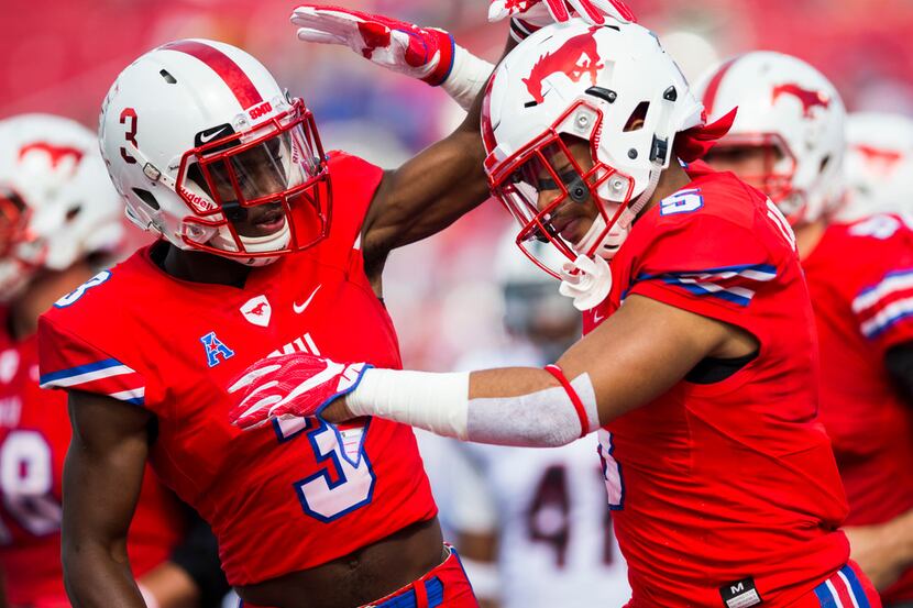 FILE - SMU running back Xavier Jones (5) and wide receiver James Proche (3) celebrate after...