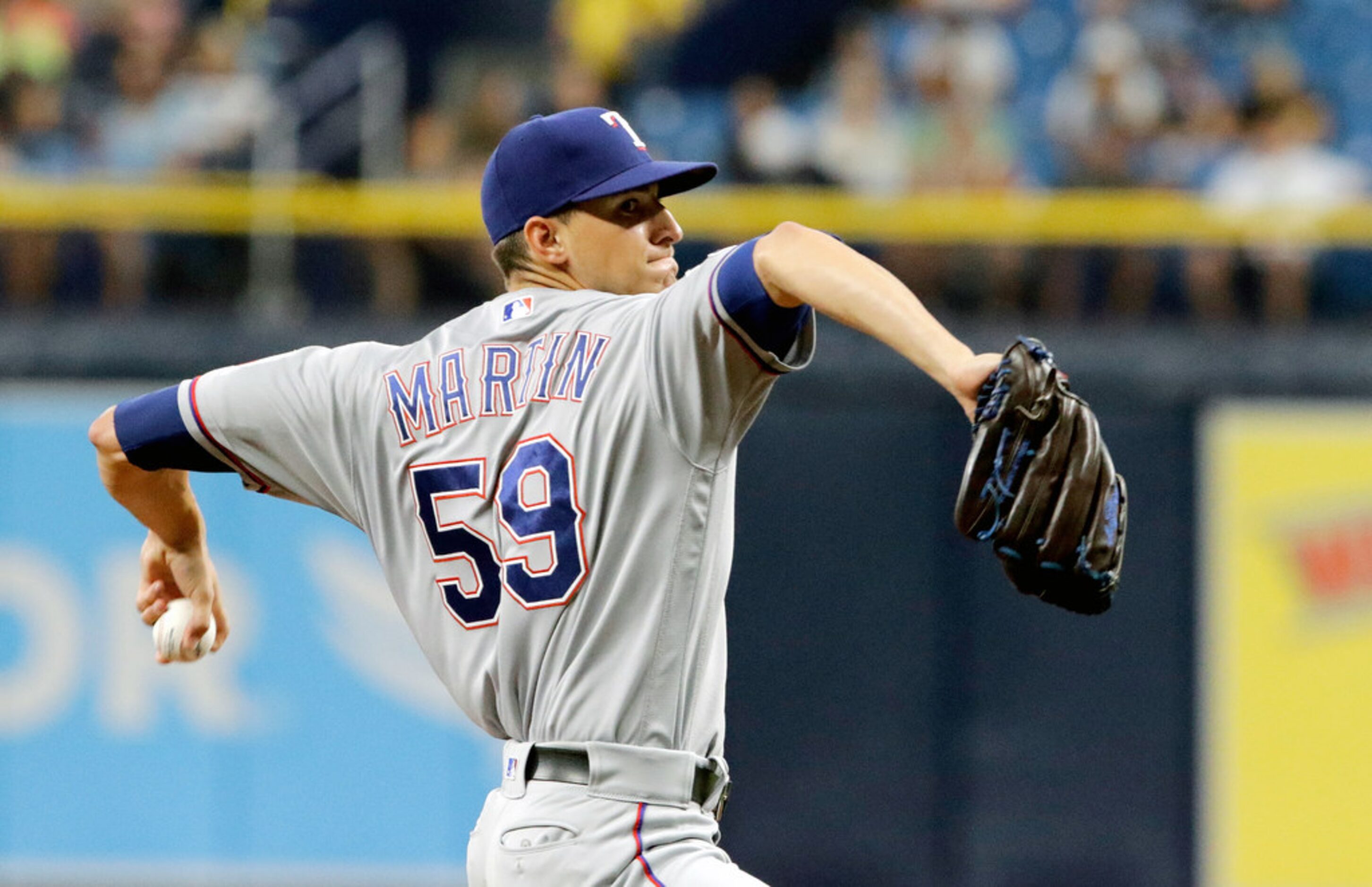 ST. PETERSBURG, FL - JUNE 30:  Brett Martin #59 of the Texas Rangers delivers a pitch in the...