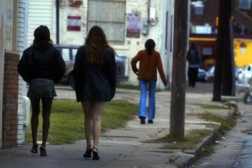 Prostitutes walk a Dallas street on a weekend afternoon.