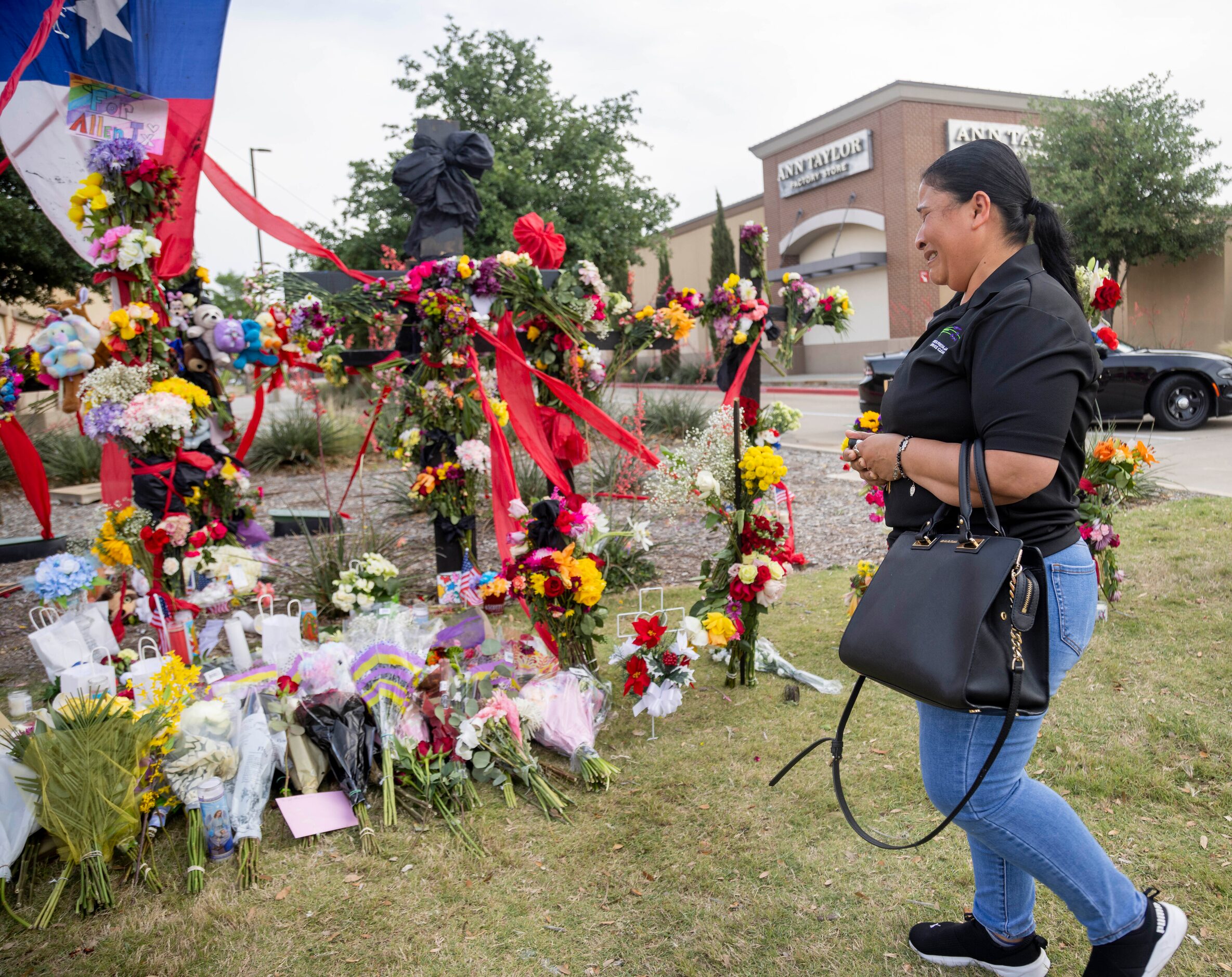 Yvi Beatriz Leon, who was shopping at the time of the shooting, cries while at the memorial...