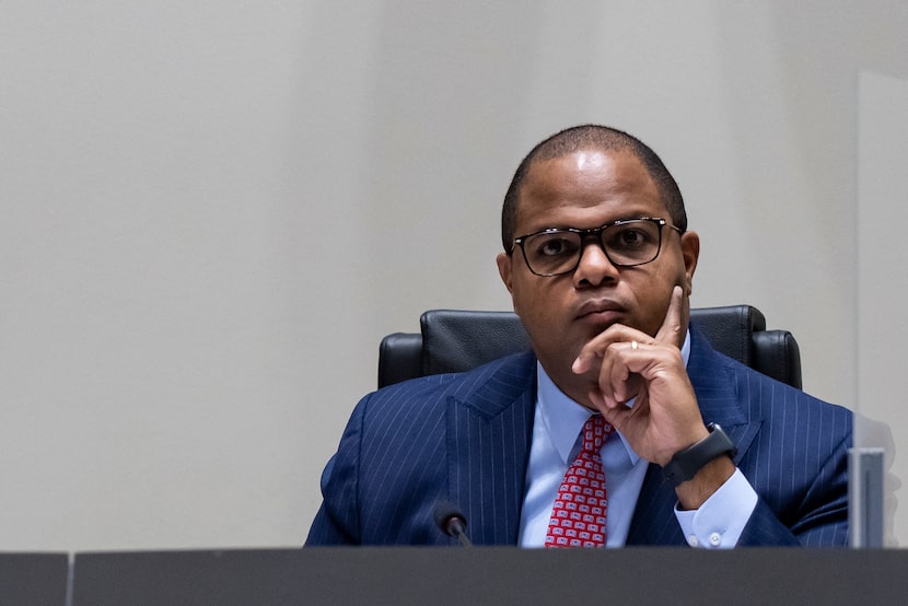 Dallas Mayor Eric Johnson listens to a member of the community address a concern during a...