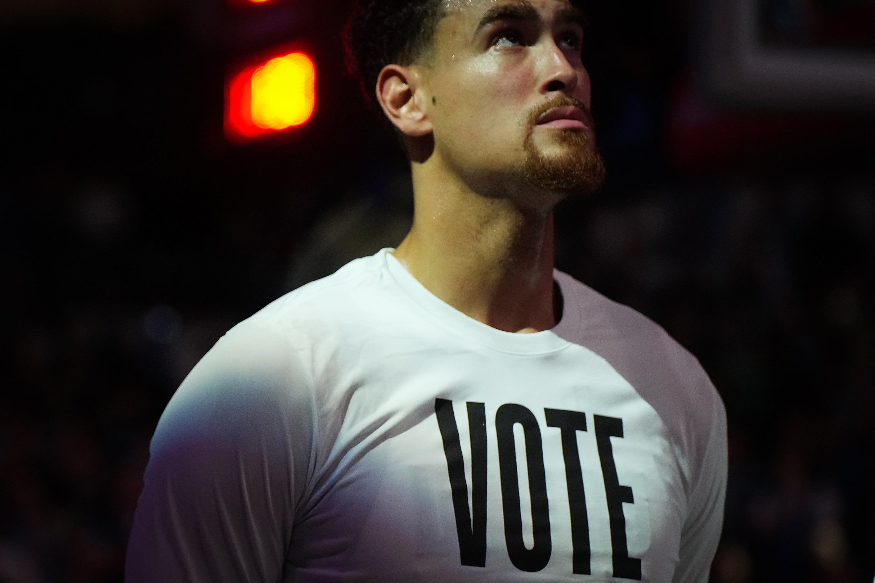 Dallas Mavericks center Dwight Powell stands for the national anthem wearing a t-shirt...