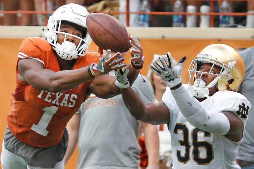 Texas wide receiver John Burt (1) can't corral a long pass in the second quarter as Notre...