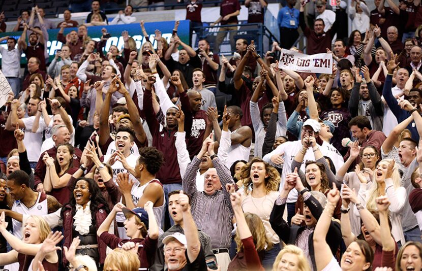  Texas A&M Aggies players, family and fans celebrate a victory over the Northern Iowa...