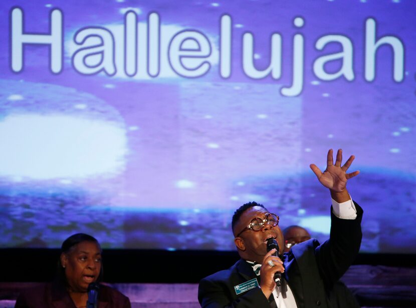  Andrew D. Sims sings while mourners enter for the funeral service of Christian Taylor...