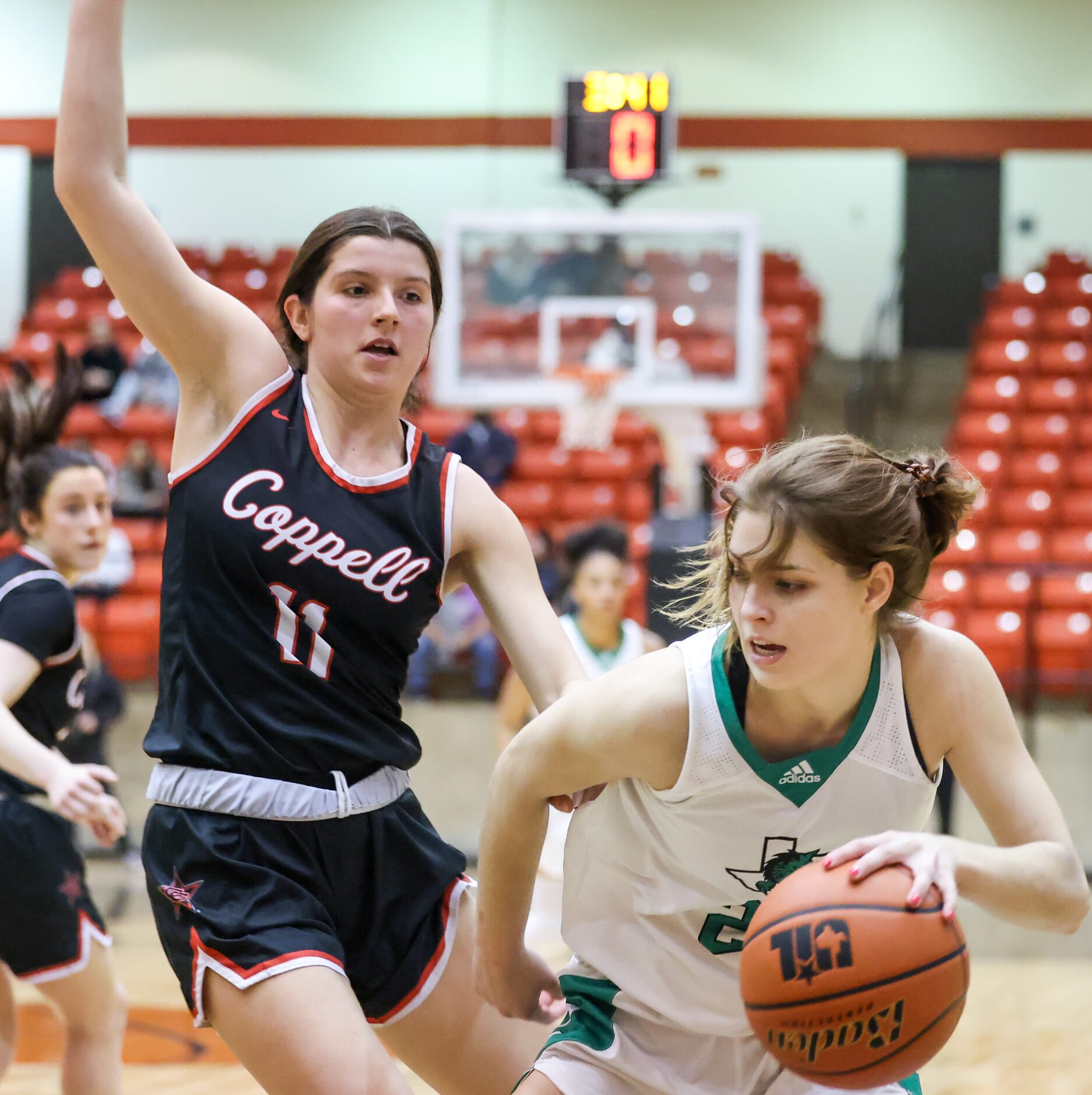 Coppell senior guard Waverly Hassman (11) pressures Southlake Carroll senior guard Camryn...