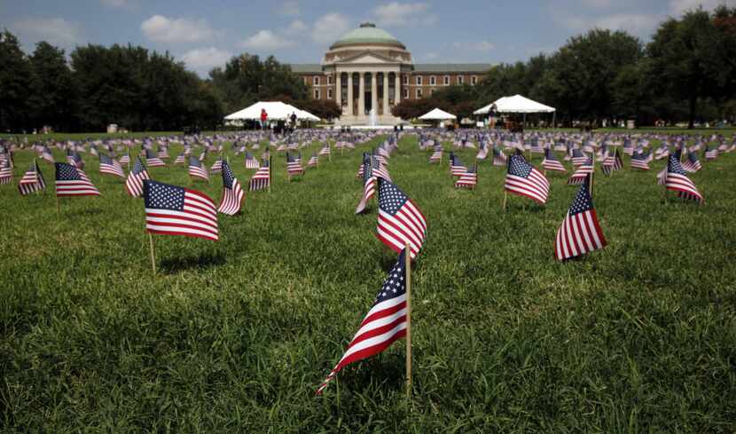 SMU students walked by a display of boots and flags on Sept. 10, 2010, on campus. (David...