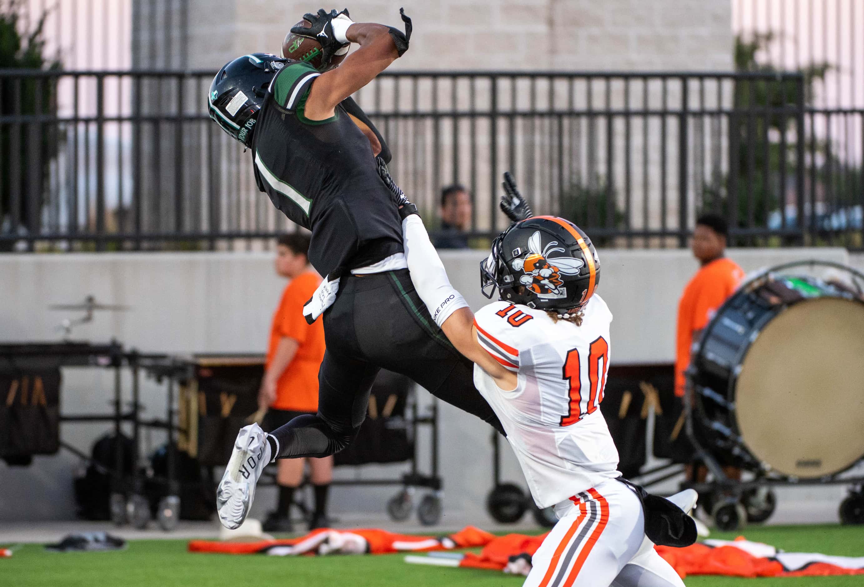 Prosper's Hunter Summers (1) catches a touchdown pass over Rockwall's safety Brendon Ross...