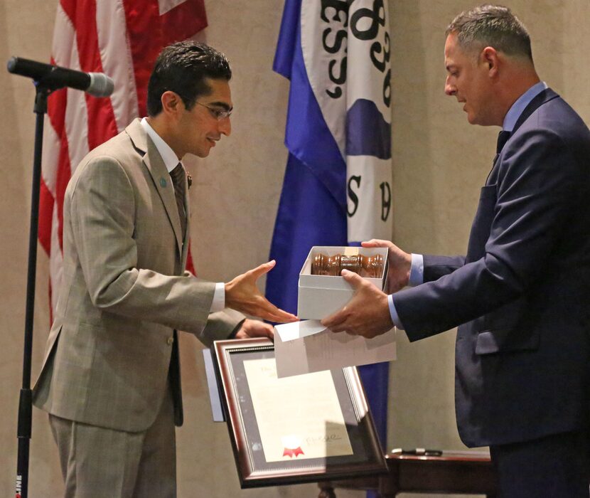 State Rep. Rafael Anchia, D-Dallas, presented Salman Bhojani a gavel after Bhojani's...