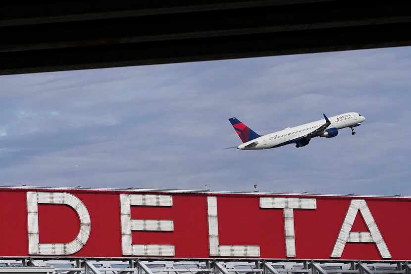 FILE - A Delta Air Lines plane takes off from Hartsfield-Jackson Atlanta International...