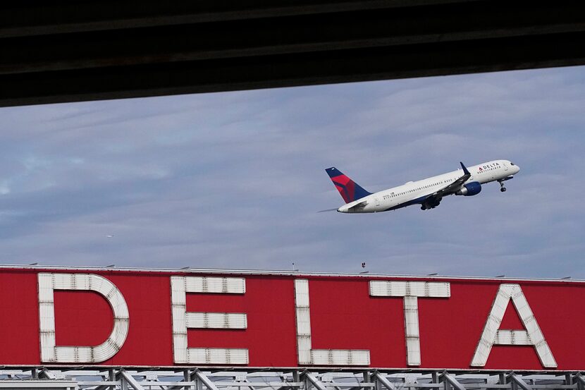 FILE - A Delta Air Lines plane takes off from Hartsfield-Jackson Atlanta International...