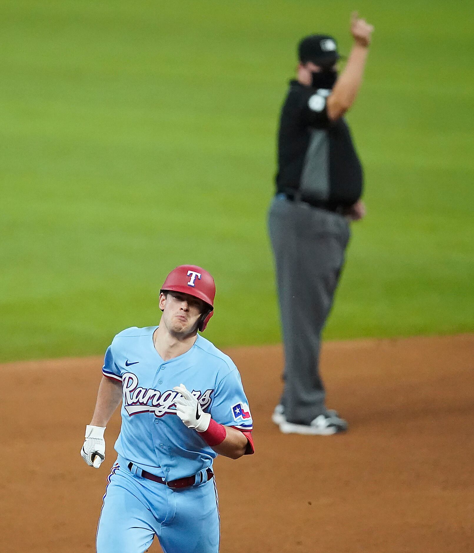 Texas Rangers outfielder Nick Solak rounds the bases after Los Angeles Angels right fielder...