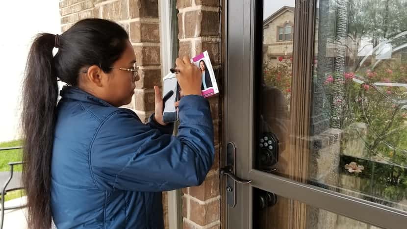 Congressional candidate Jessica Cisneros leaves a flyer at a home in Live Oak, Texas, on...