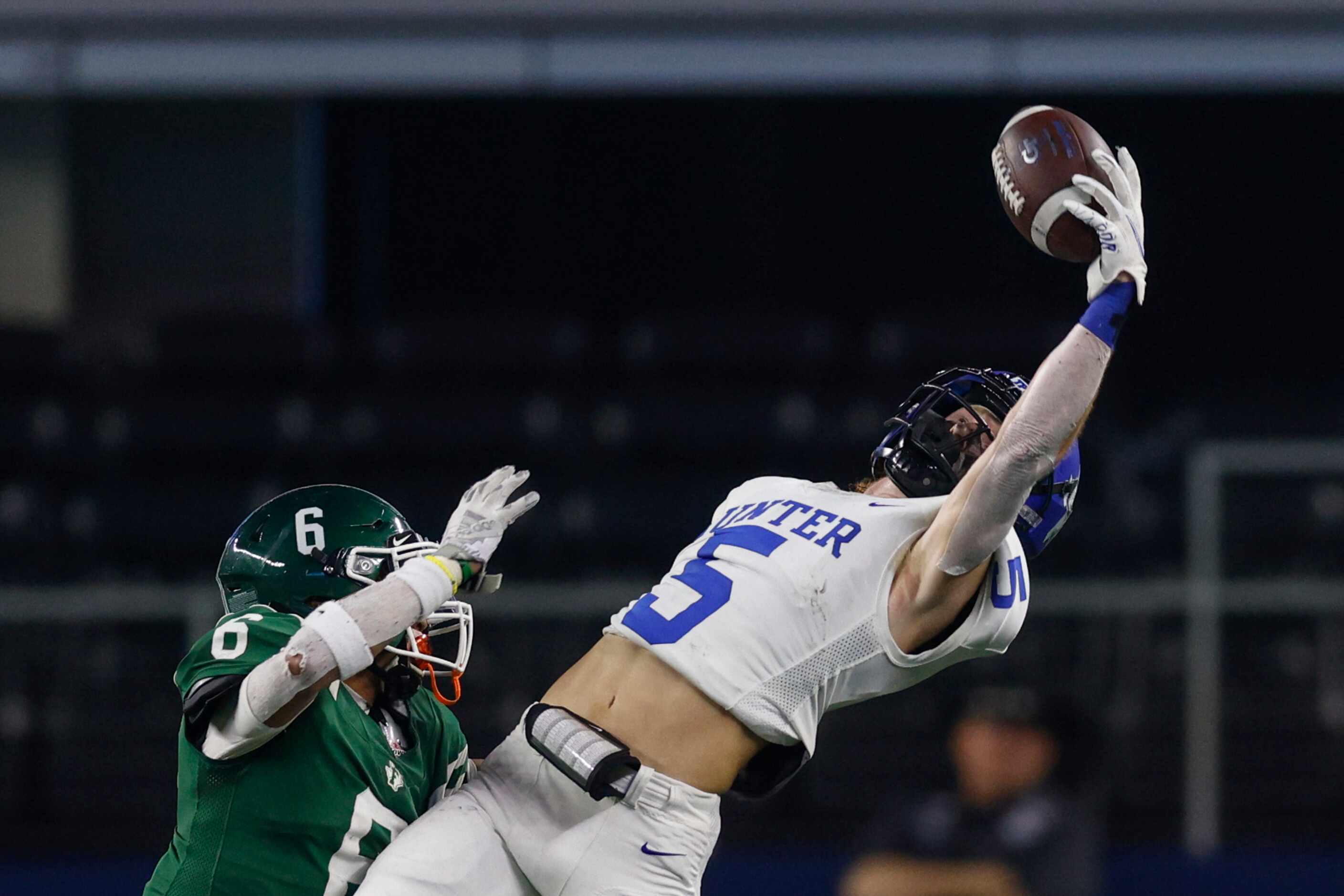 Gunter wide receiver Cannon Lemberg (5) attempts a one-handed catch over Franklin defensive...