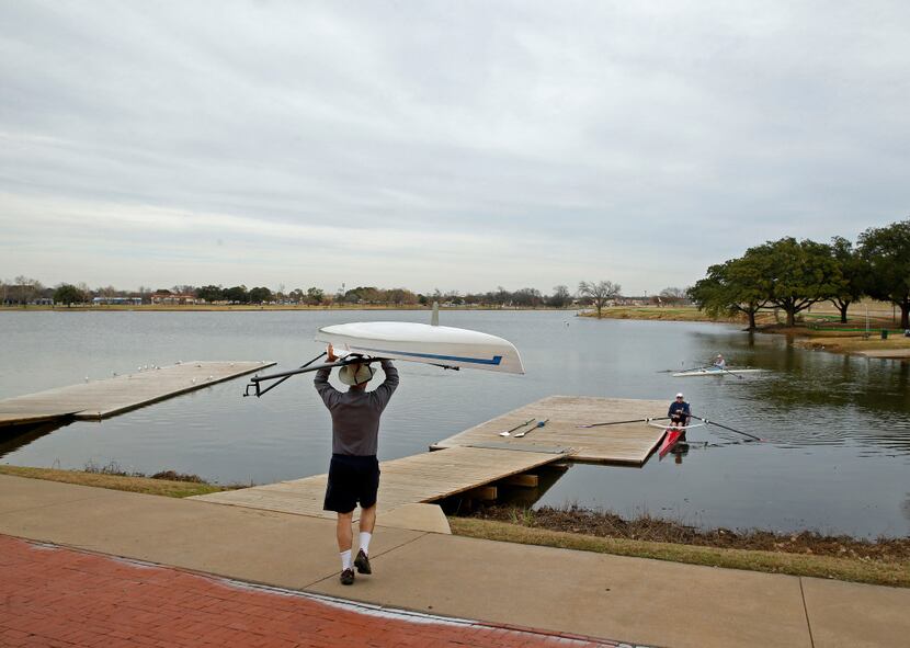 Dallas Rowing Club member Patrick Genevein takes his boat out for a workout at Bachman Lake...