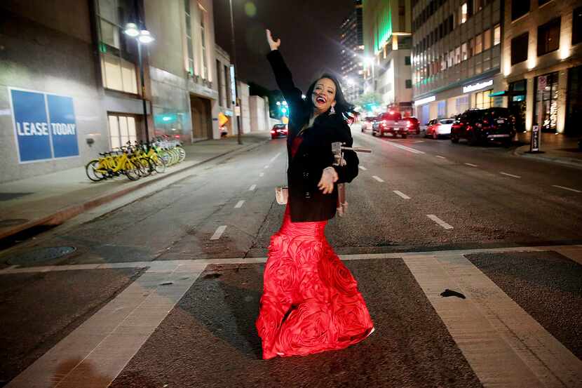 Candace Perry of Addison poses spontaneously while walking to a New Year's Eve party in...