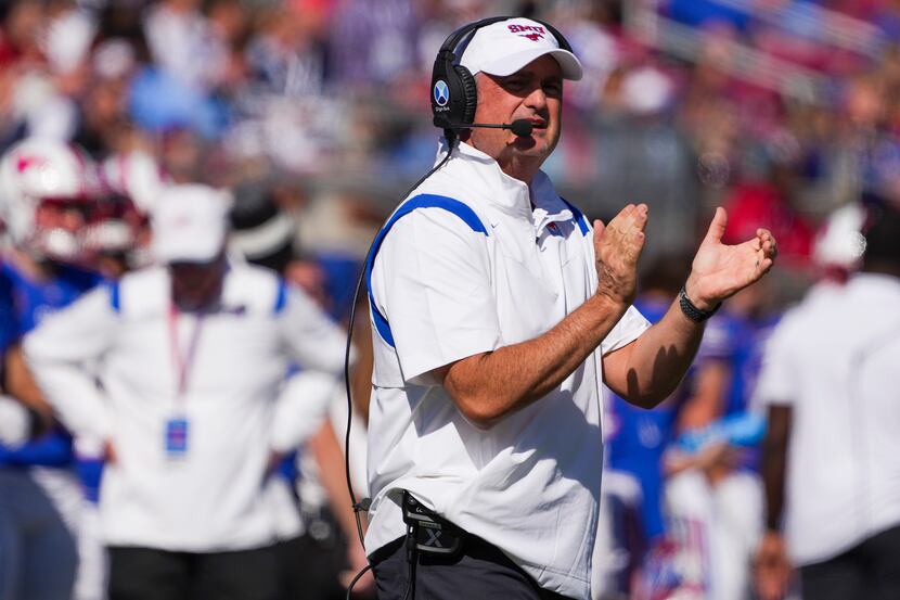 SMU head coach Sonny Dykes cheers a play during the first half of an NCAA football game...