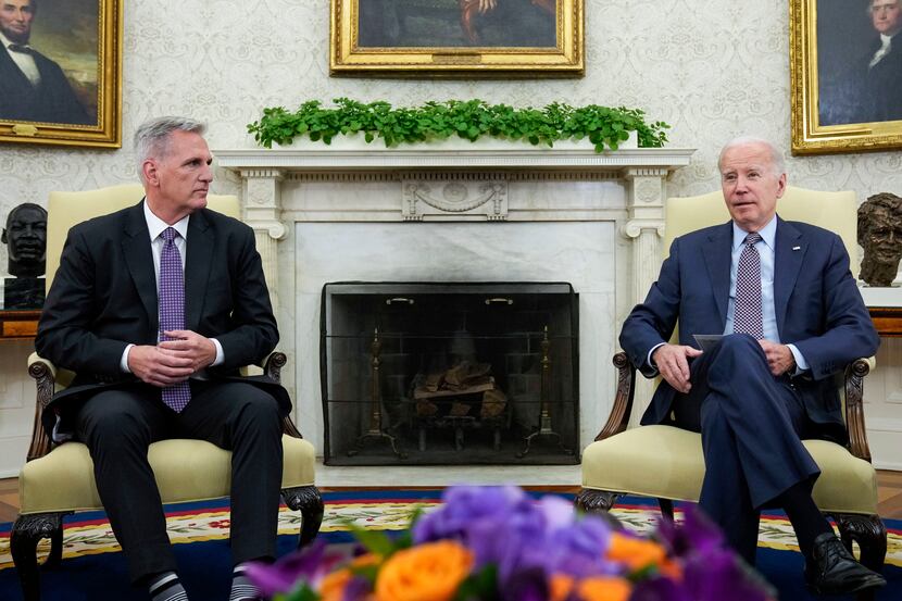 FILE - President Joe Biden meets with House Speaker Kevin McCarthy of Calif., to discuss the...