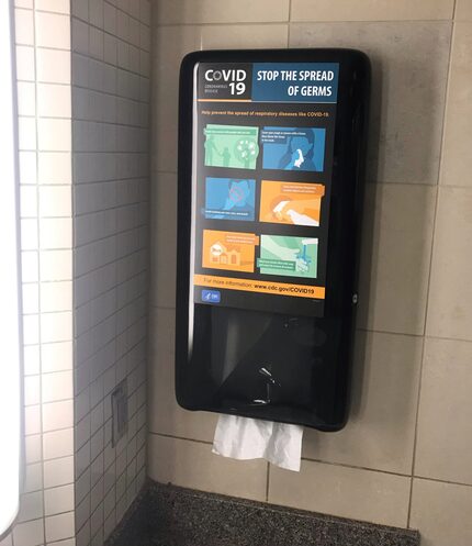 A paper towel dispenser in a restroom at DFW International Airport includes a tracker to...