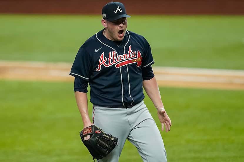 Atlanta Braves relief pitcher Tyler Matzek reacts after striking out Los Angeles Dodgers...