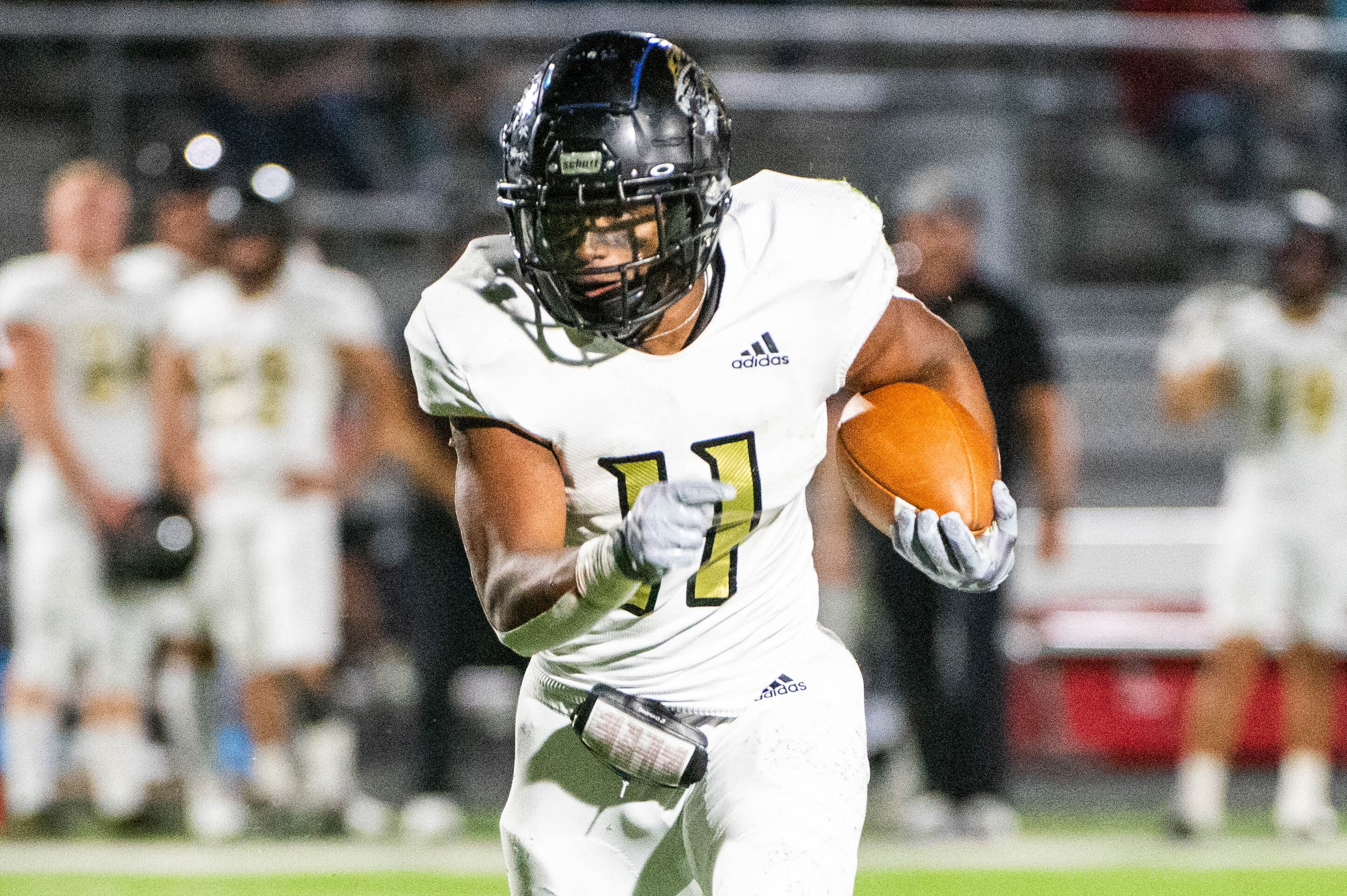 Kaufman’s Braxton Garmon runs upfield in the first half during a high school football game...