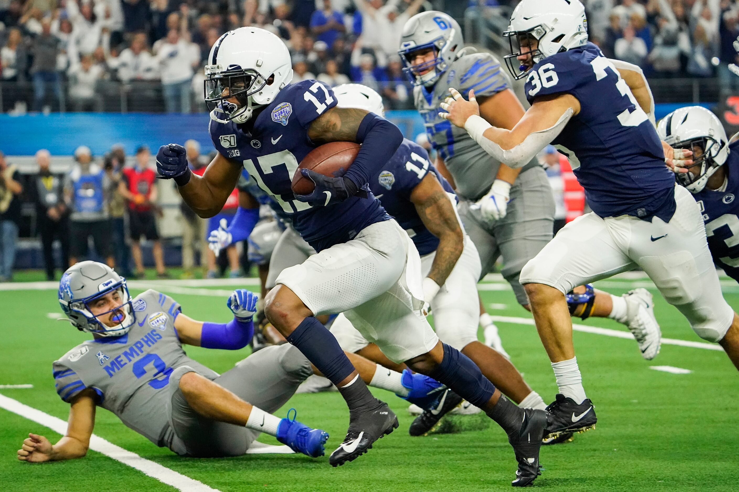 Penn State safety Garrett Taylor (17) returns an interception 15-yards for a touchdown past...