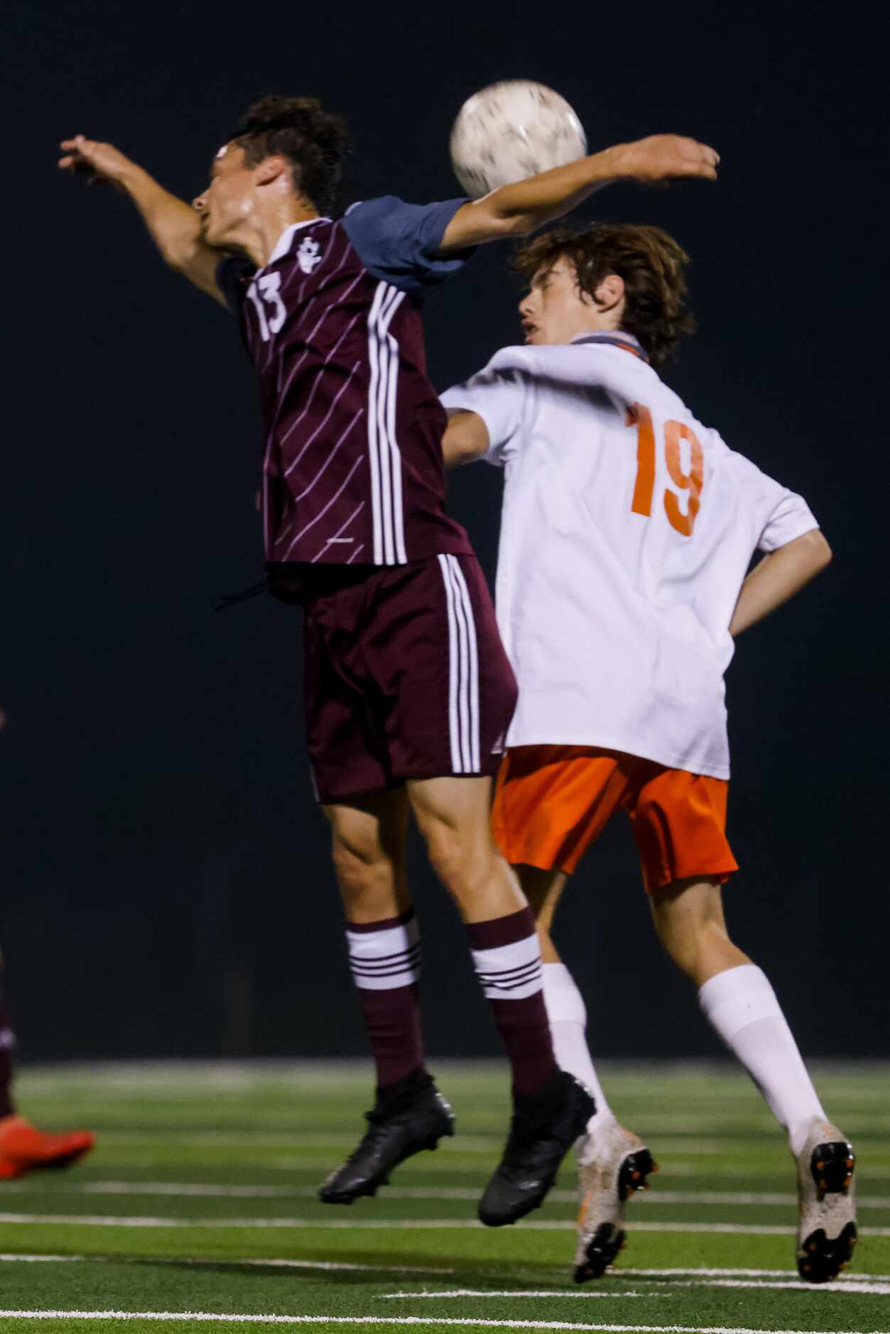 Celina's Andy Allam (19) and Palestine's Ty Carnes (13) go for the ball during the first...