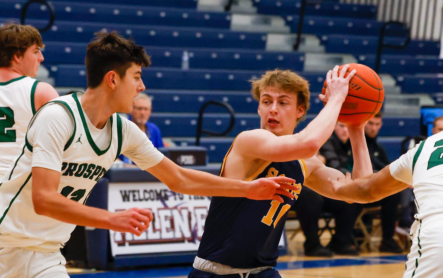 Prosper senior Brandt Evanson (12) moves to gaurd Highland Park senior Riter White (10)...