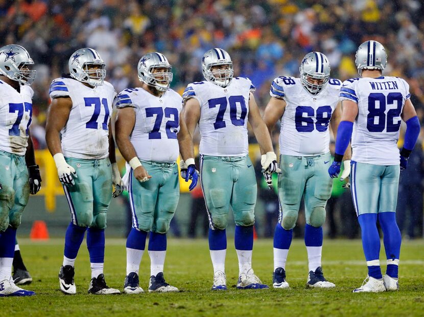 The Dallas Cowboys offensive line including, tackle Tyron Smith (77), offensive guard La'el...