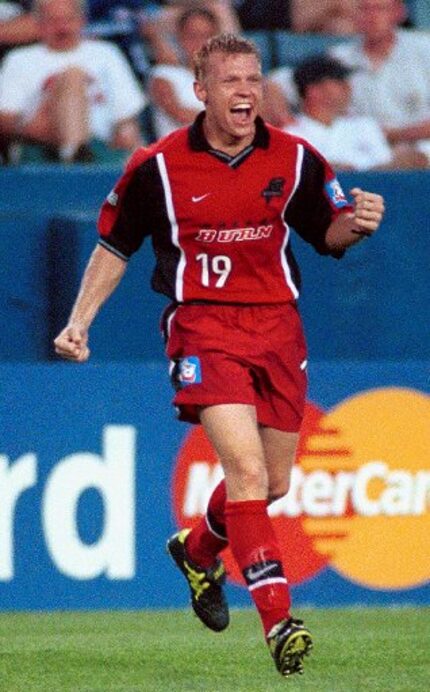 ORG XMIT: S0332345932_WIRE Dallas Burn forward Bobby Rhine celebrates his goal against the...