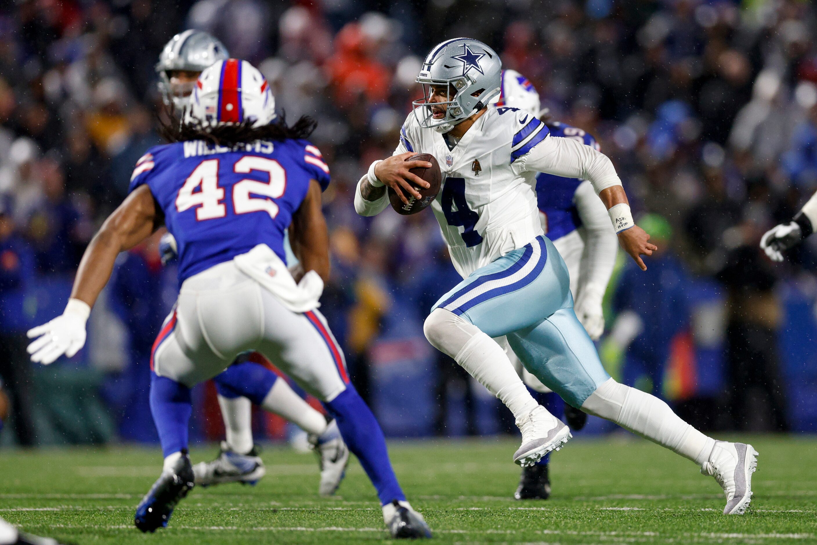 Dallas Cowboys quarterback Dak Prescott (4) runs the ball during the second half of an NFL...