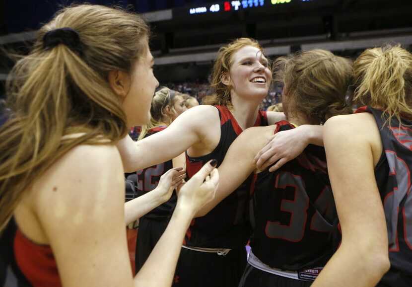 Argyle's Vivian Gray, center, celebrates with her teammates as they win over Waco La Vega...