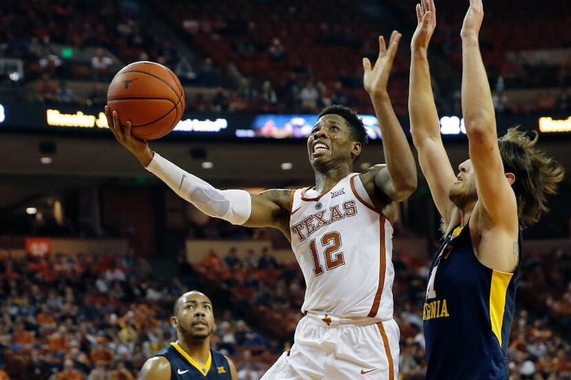 AUSTIN, TX - JANUARY 14: Kerwin Roach Jr. #12 of the Texas Longhorns leaps to the basket...
