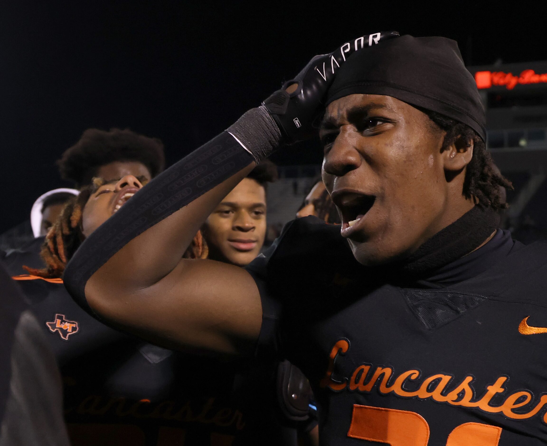 Lancaster linebacker Dylan Sandles (31), right, reacts at midfield following the Tigers'...