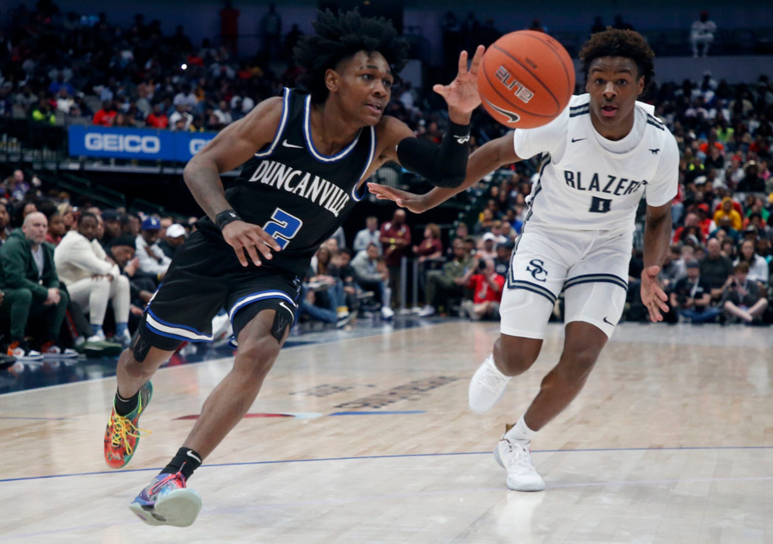 Duncanville's Ja'Bryant Hill  (2) drives past  Sierra Canyon's Bronny James (0) during their...