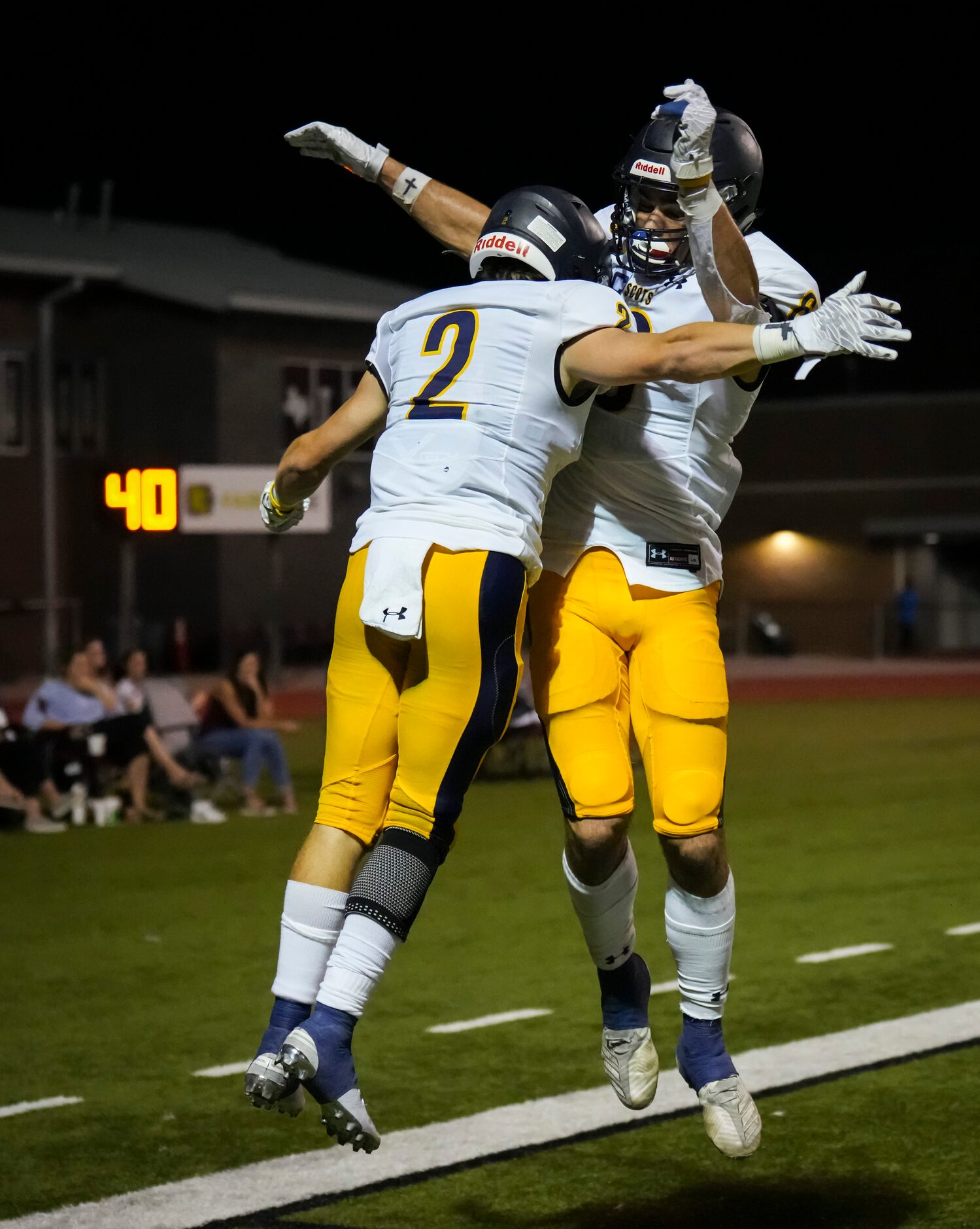 Highland Park wide receiver Grayson Schrank (2) celebrates with wide receiver Luke Herring...