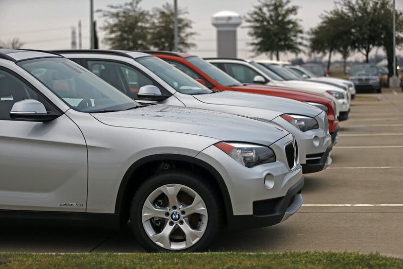 Some of the new car inventory on the lot of Classic BMW in Plano on Friday, December 28,...