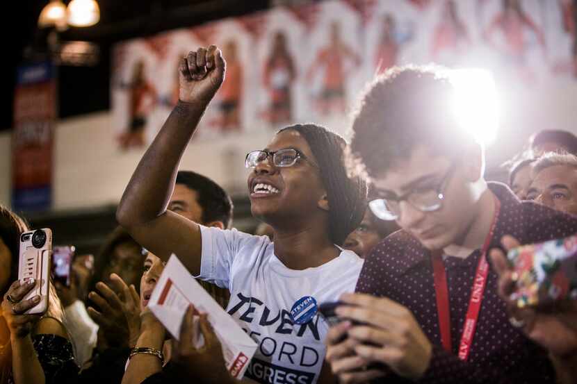 Young supporters listen as former President Barack Obama spoke at a get-out-the-vote rally...