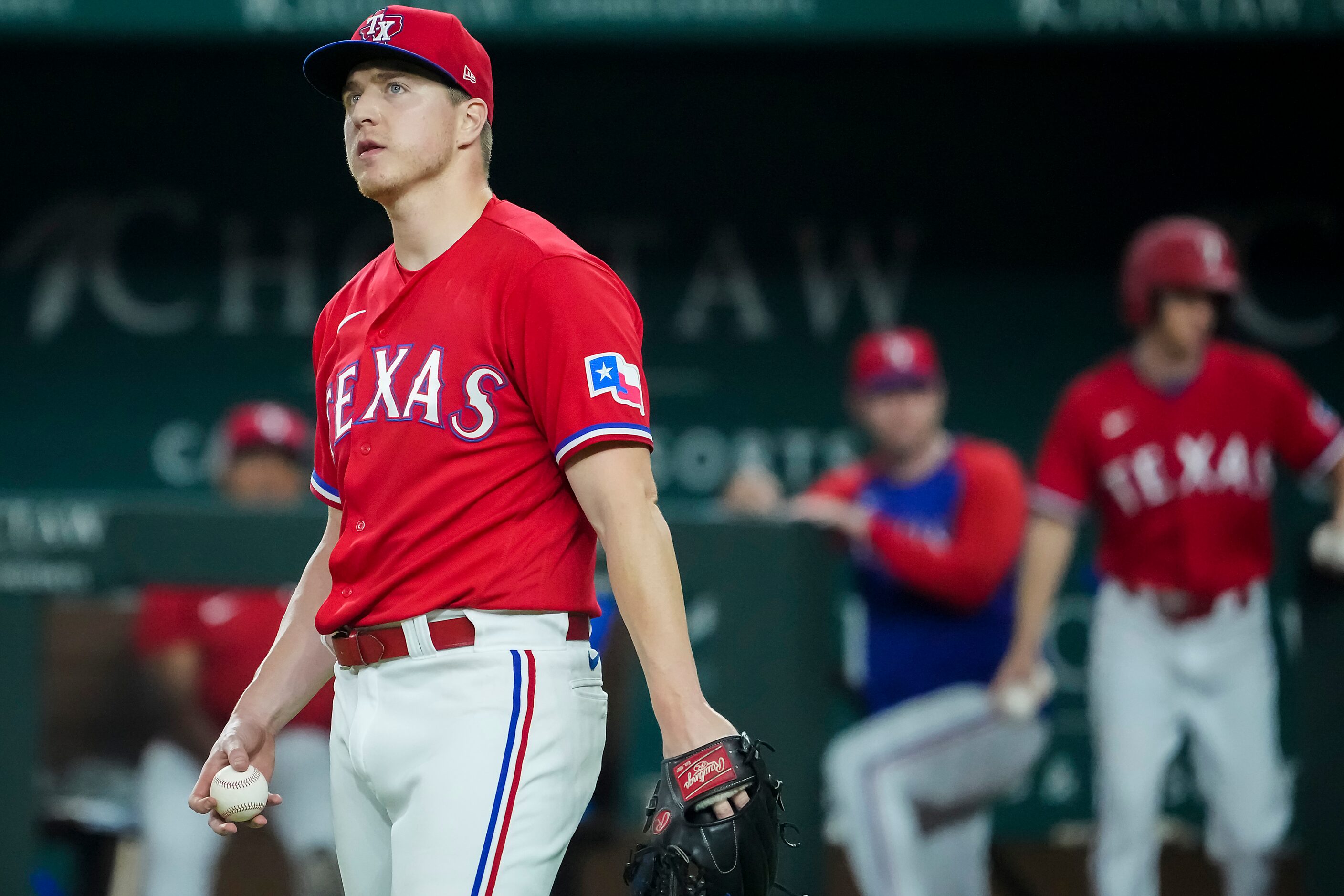 Texas Rangers relief pitcher Josh Sborz reacts after giving up a bases loaded walk during...