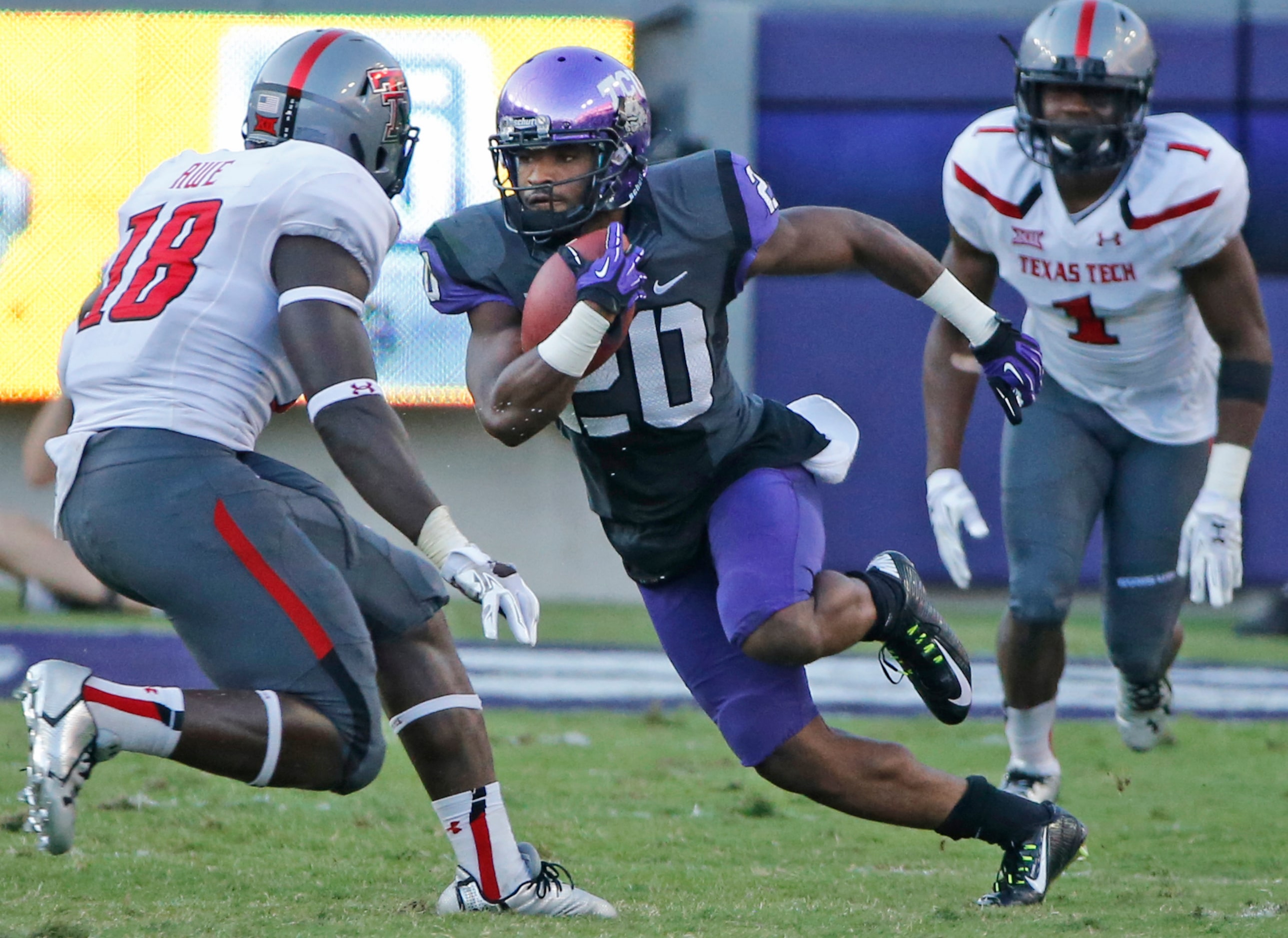 TCU receiver Deante' Gray (20) breaks loose on a long touchdown run in the third quarter, as...